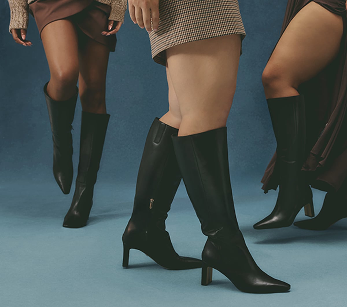 women wearing tall boots in various calf widths and extended sizes