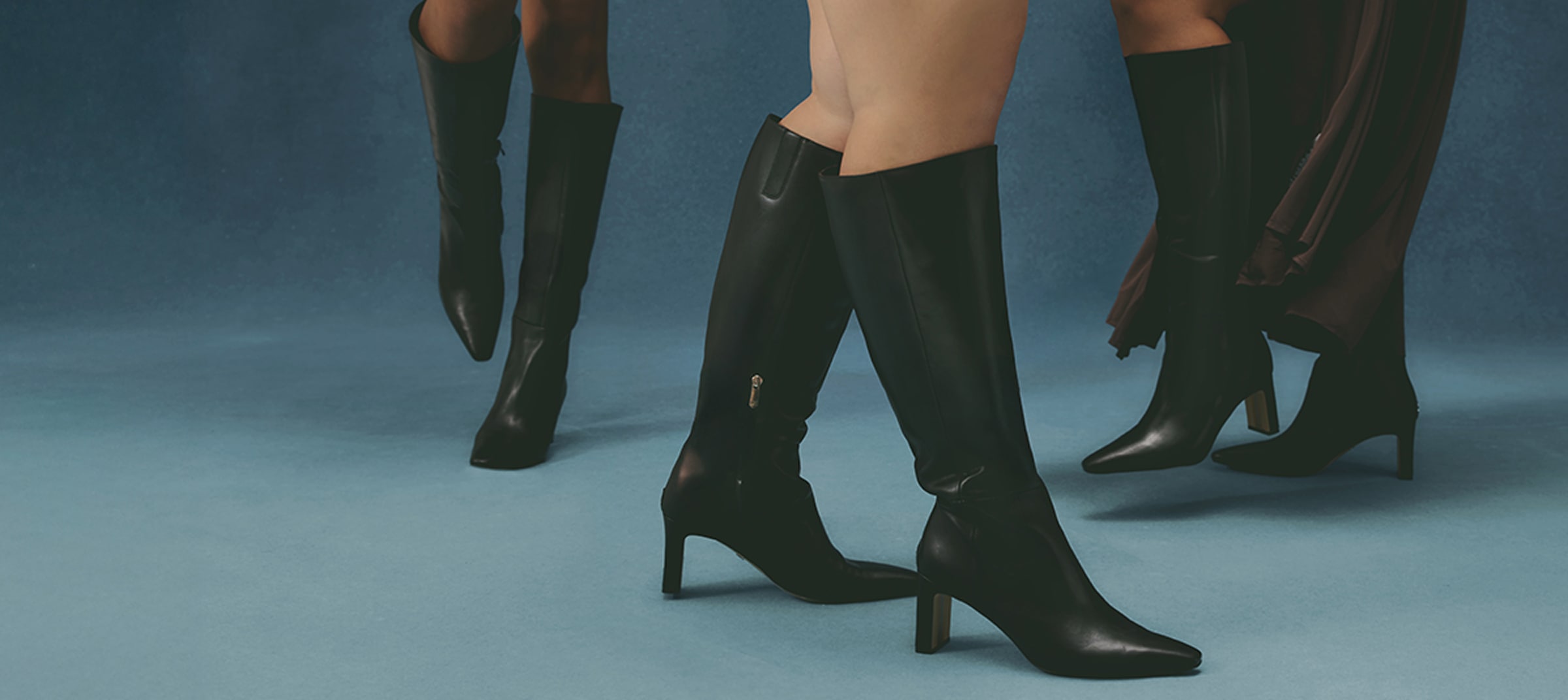 women wearing tall boots in various calf widths and extended sizes