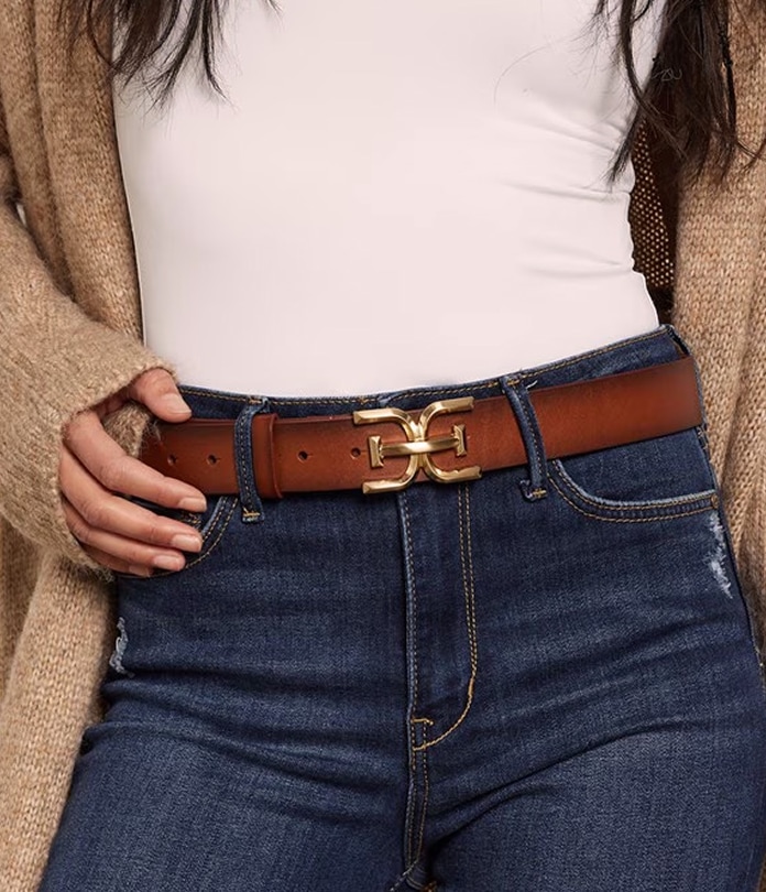 woman wearing a brown belt with gold detailing by sam edelman