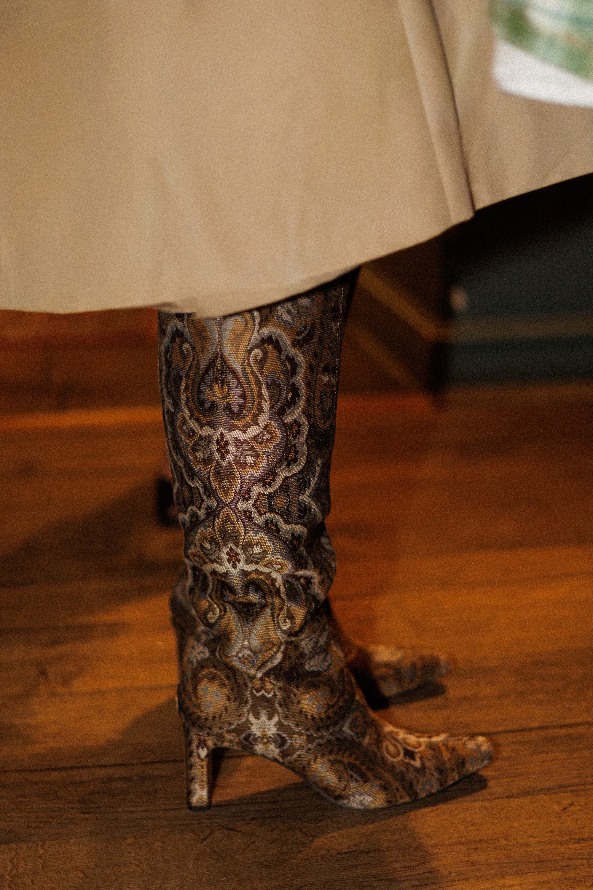 sylvia knee high boot in an olive paisley pattern