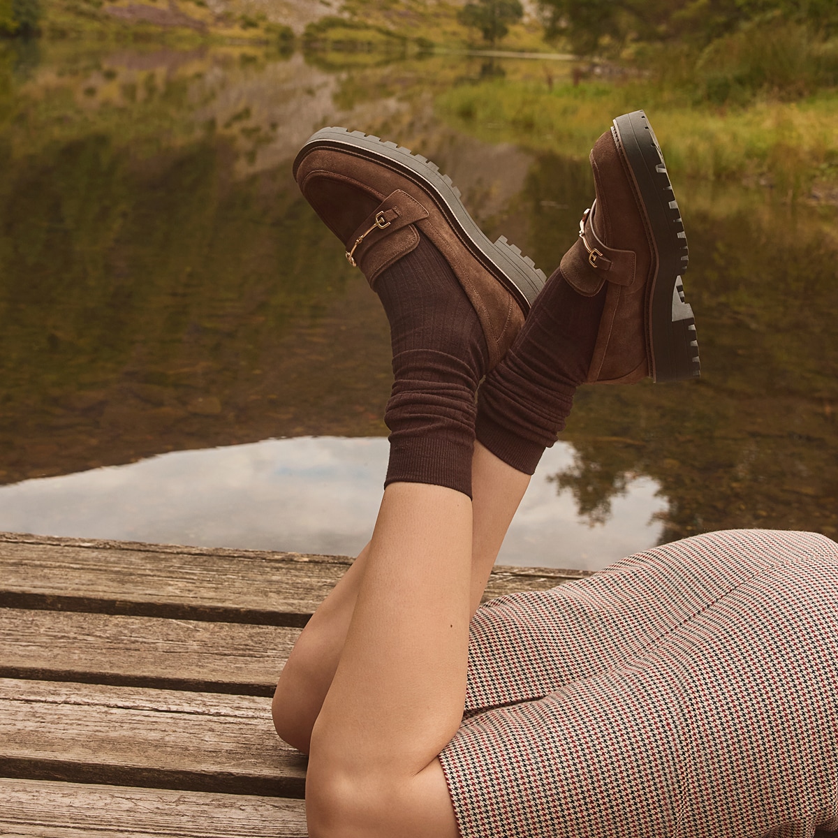 woman wearing the lea platform loafer in mustang brown suede with matching brown socks