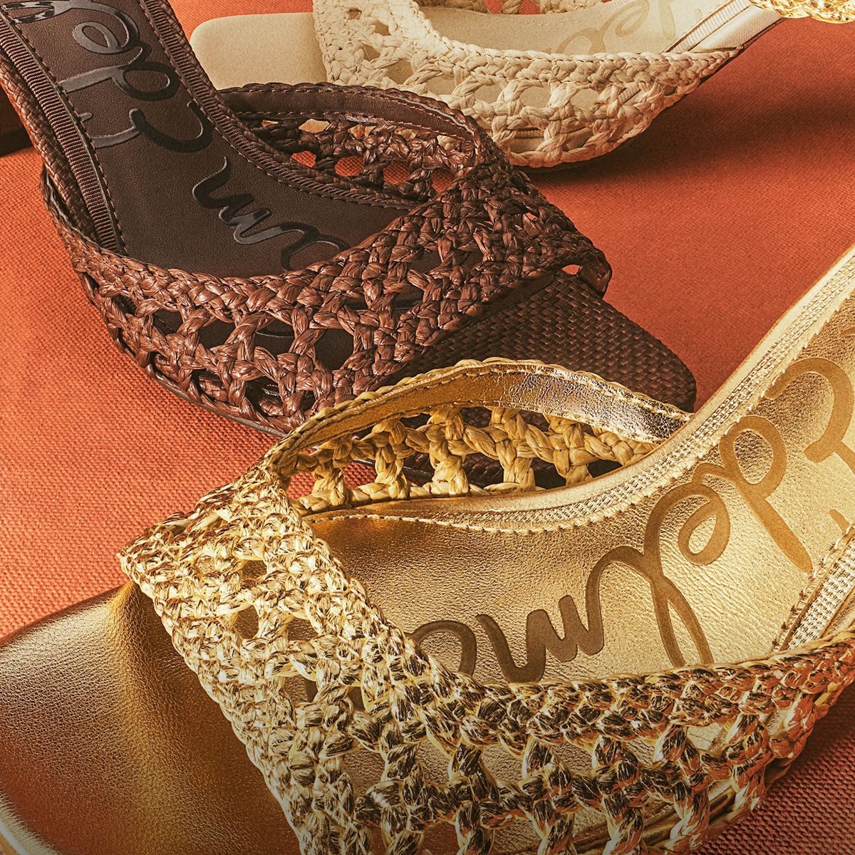 Sam Edelman Peyton Kitten Heel Sandals showcasing the woven faux raffia texture in amber gold and terazzo brown.