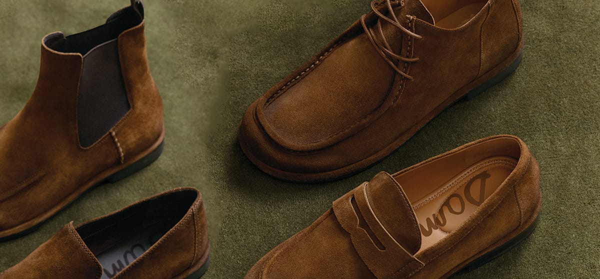 various men's shoes in brown - loafers, Chelsea boots, oxfords